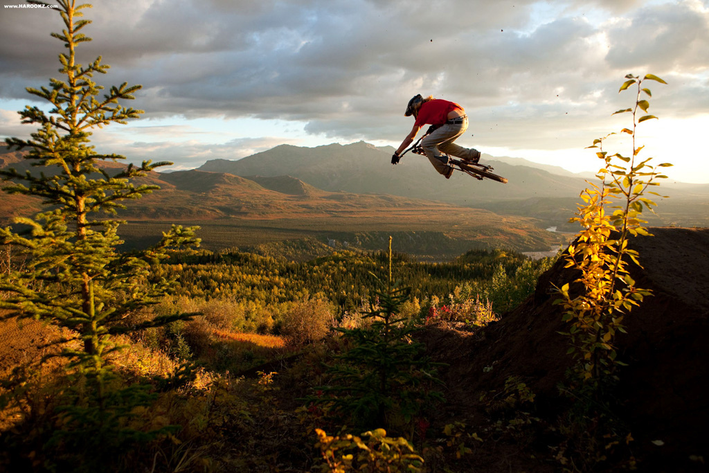 This was one of two golden light action sessions we were provided with. It's funny how the light always fires early on in a trip when we're out scouting and building the goods. The dirt in this zone is what we all dream of. Endless scoops of chocolate fudge with an absence of roots and rocks. It didn't take us long to build an A-line inspired line with chicanes connecting lofty jumps which overlooked the valley. Here's McGazza padding his air miles.